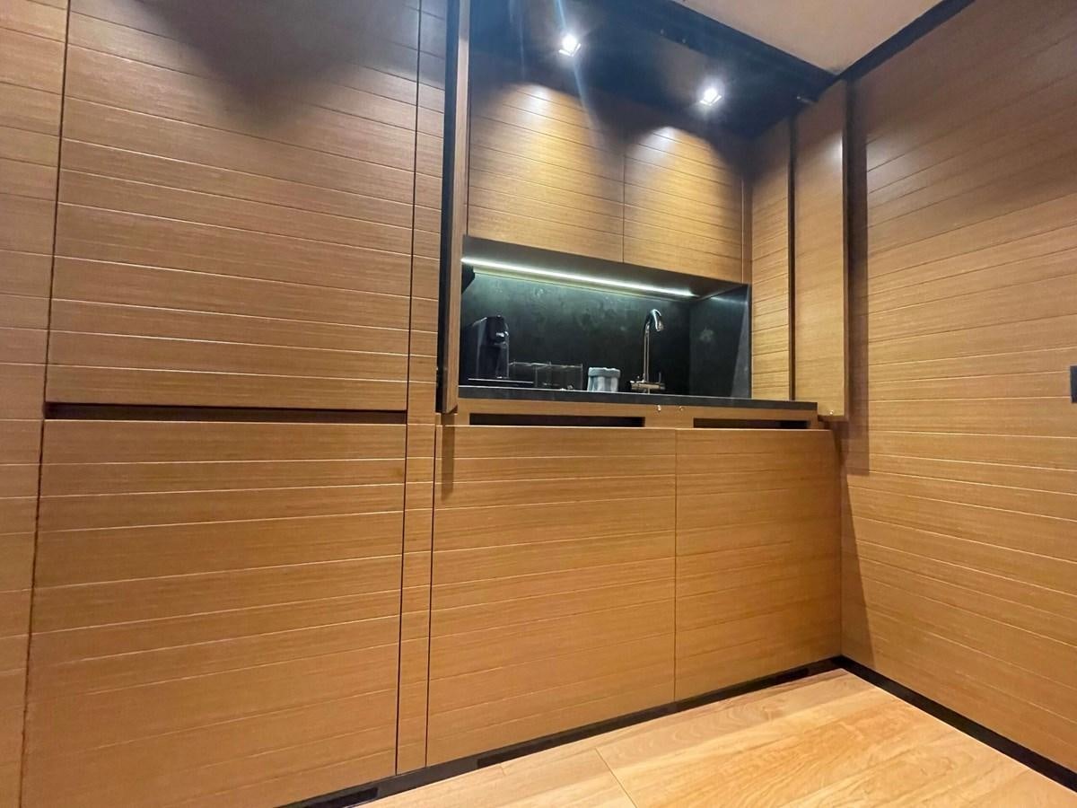 a room with a wood cabinet aboard REINE D'AZUR Yacht for Sale