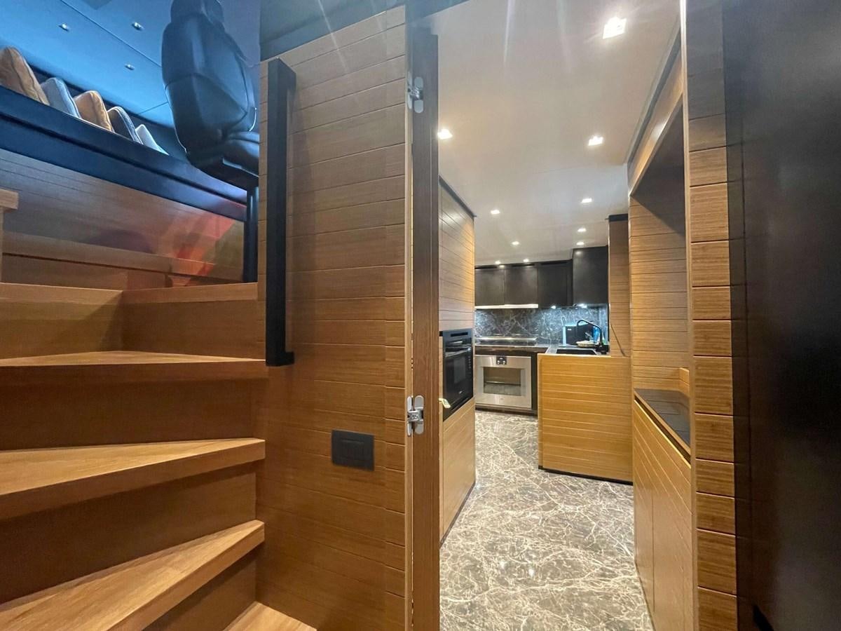 a room with a wood door and a wood cabinet and a black door aboard REINE D'AZUR Yacht for Sale