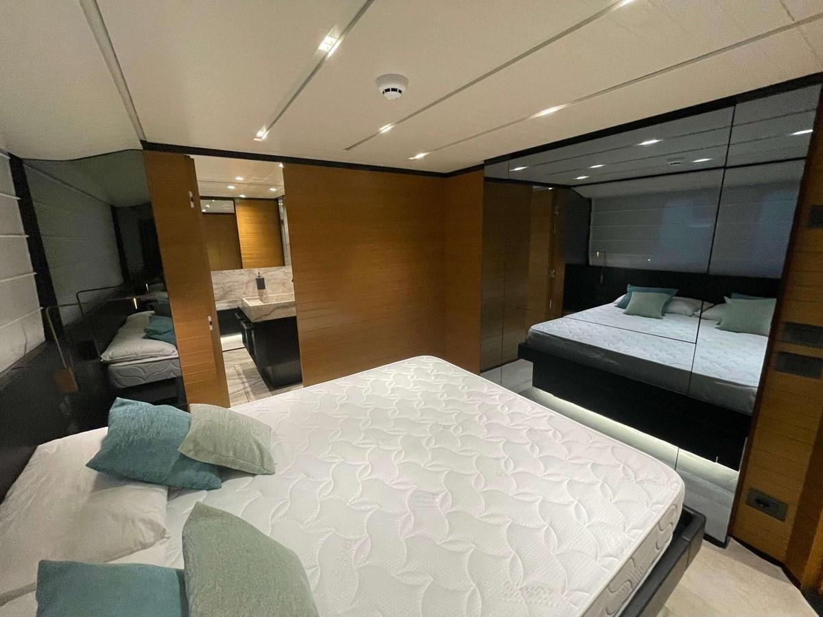 a room with a bed and a tv aboard REINE D'AZUR Yacht for Sale