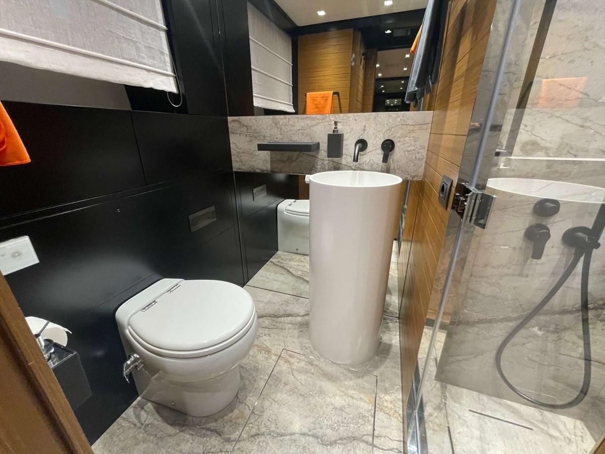 a bathroom with a glass shower aboard REINE D'AZUR Yacht for Sale