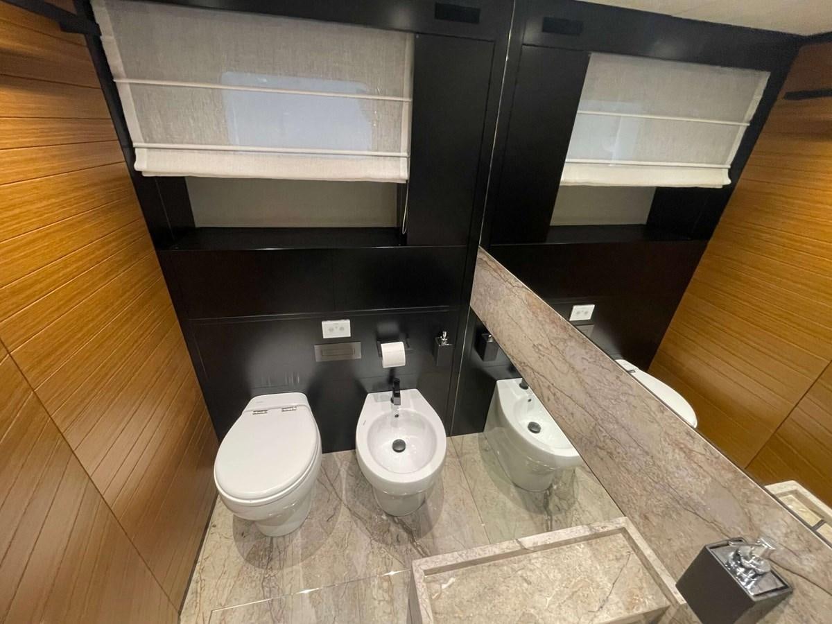 a bathroom with a toilet and a sink aboard REINE D'AZUR Yacht for Sale