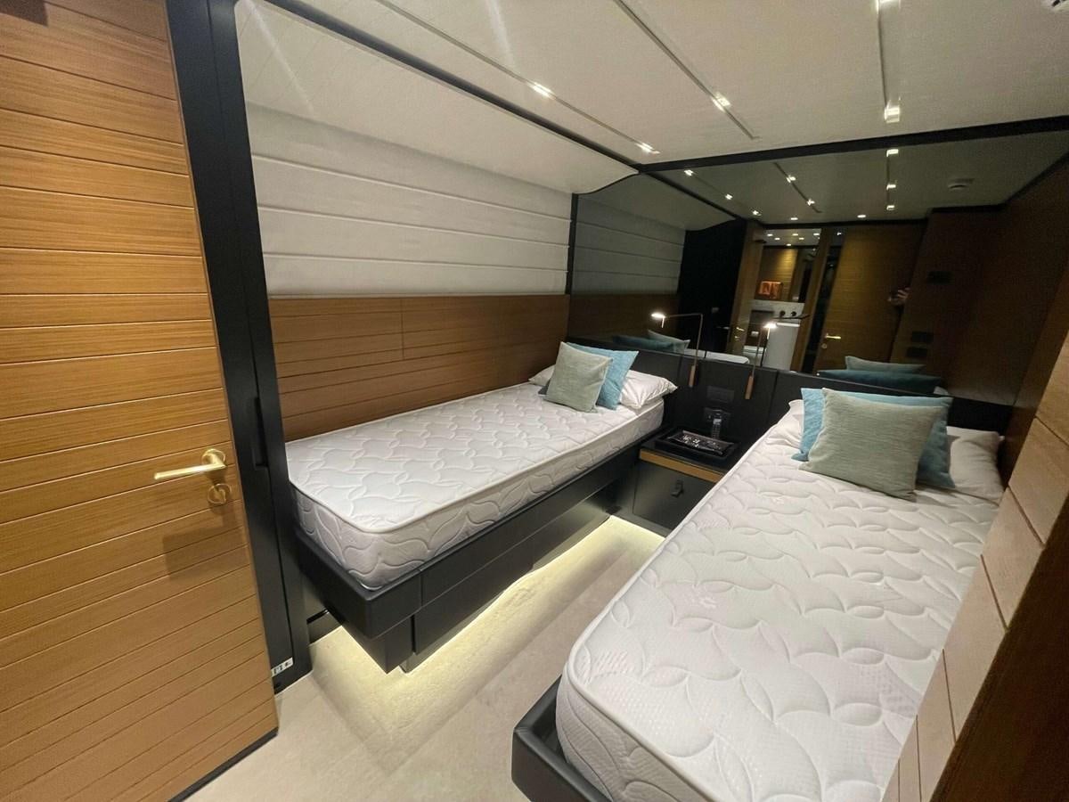 a room with two beds aboard REINE D'AZUR Yacht for Sale