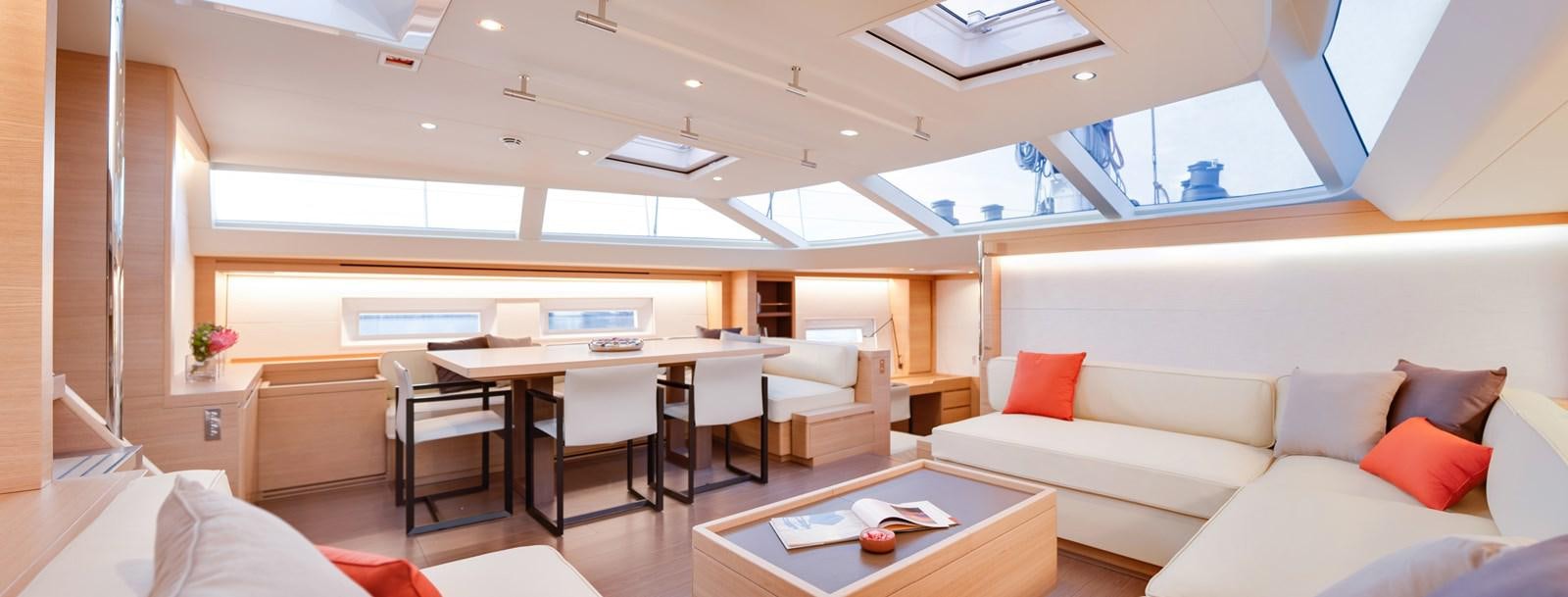 a room with a couch and a table and chairs aboard CROSSBOW Yacht for Sale