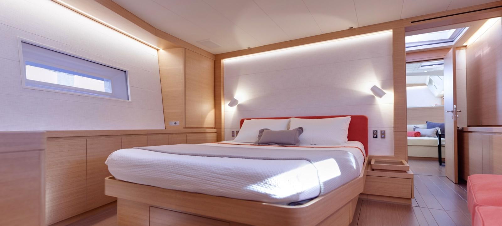 a room with a bed and a desk aboard CROSSBOW Yacht for Sale
