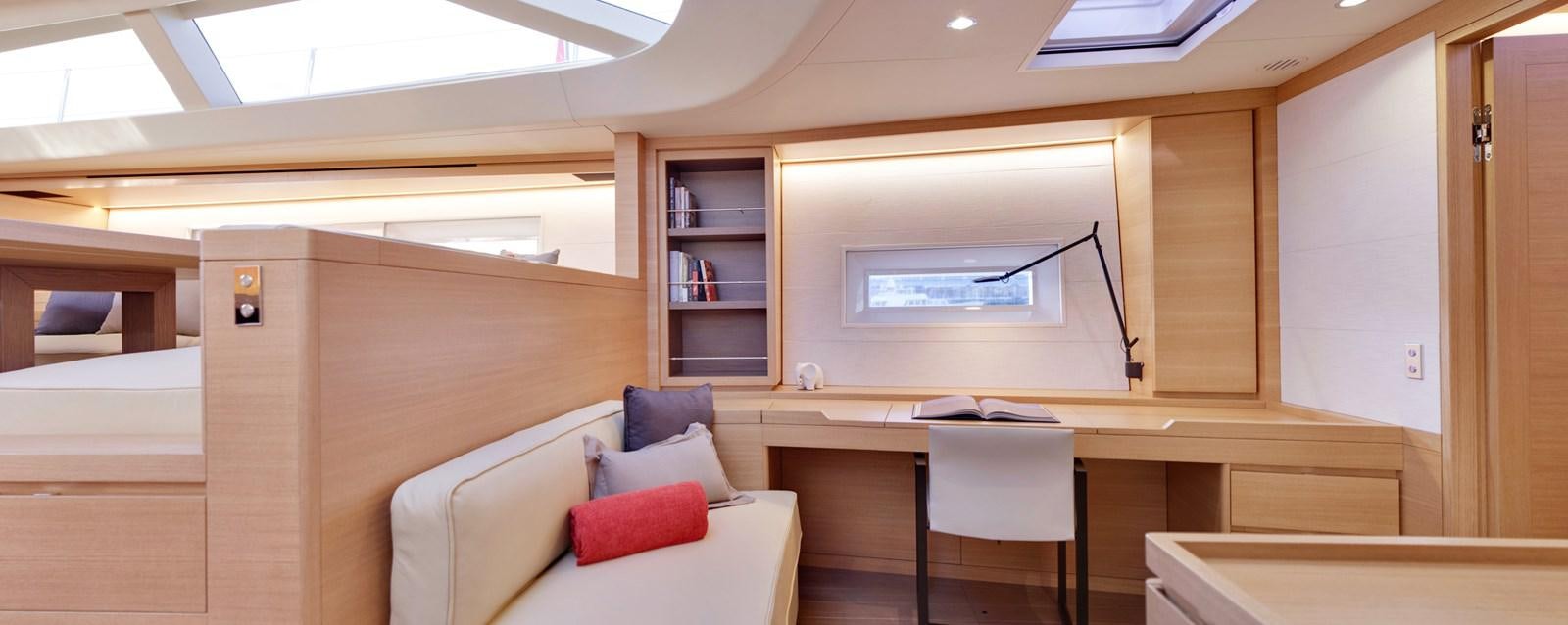 a room with a couch and a tv aboard CROSSBOW Yacht for Sale