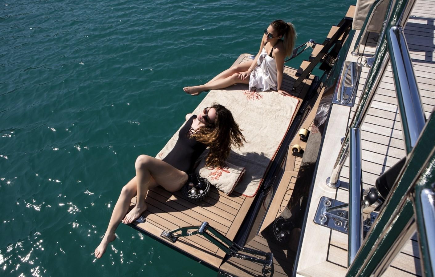 a woman and a girl in a boat aboard CROSSBOW Yacht for Sale