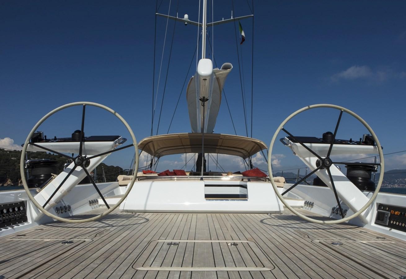 a large white boat on a dock aboard CROSSBOW Yacht for Sale