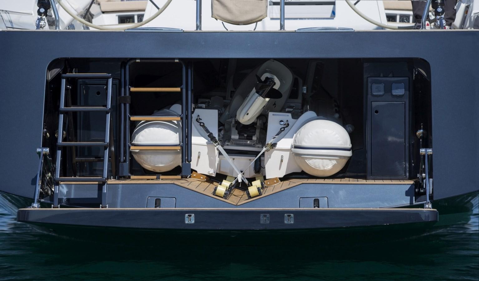 a boat with a large engine aboard CROSSBOW Yacht for Sale