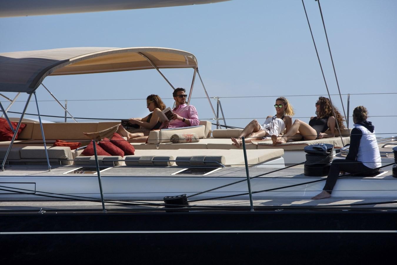 a group of people sitting on a boat aboard CROSSBOW Yacht for Sale