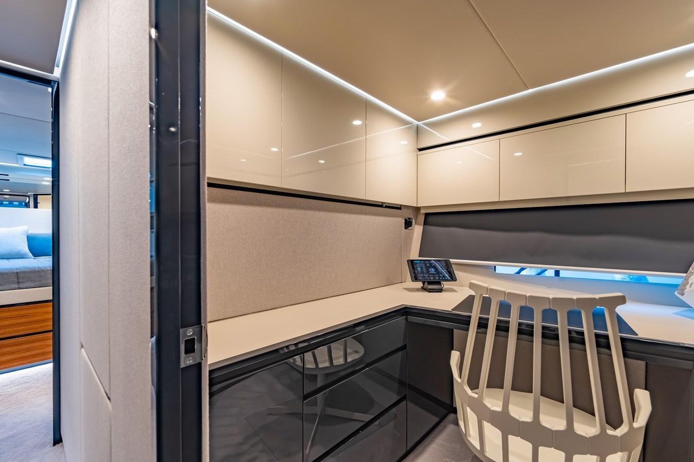 a room with a desk and chairs aboard BIG MAMA Yacht for Sale