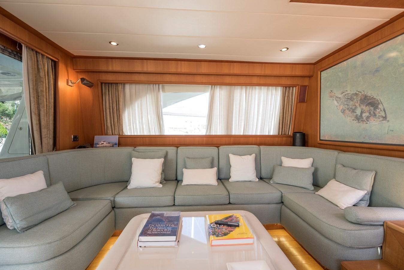a living room with a couch and a table aboard ITACATOO Yacht for Sale