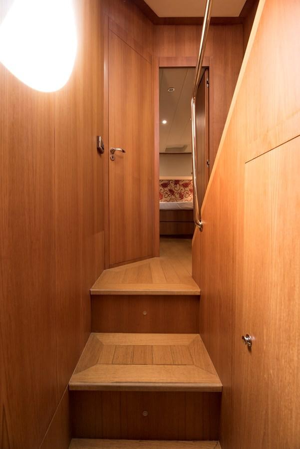 a wooden staircase in a room aboard ITACATOO Yacht for Sale