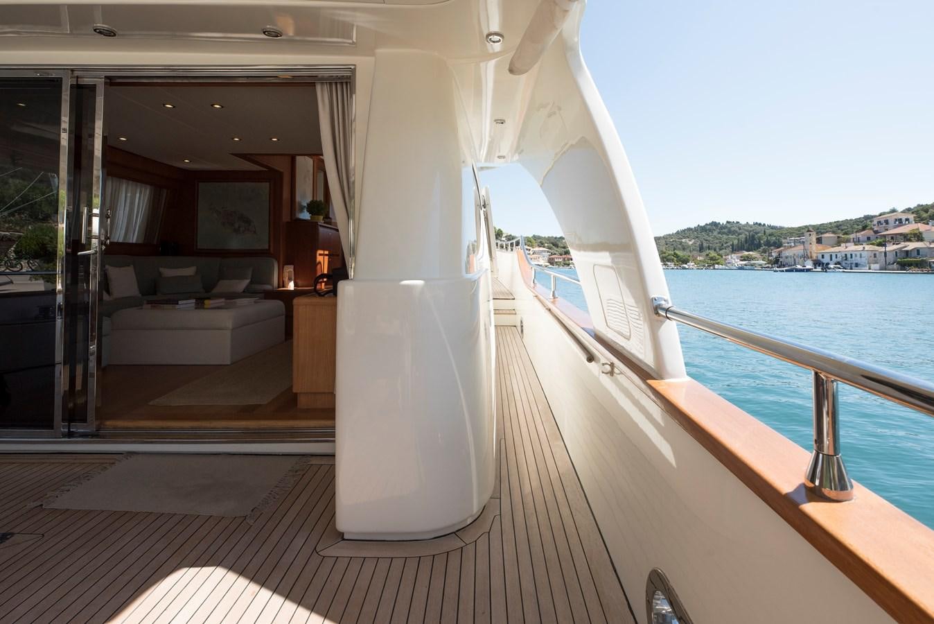 a balcony with a view of the water and a city aboard ITACATOO Yacht for Sale