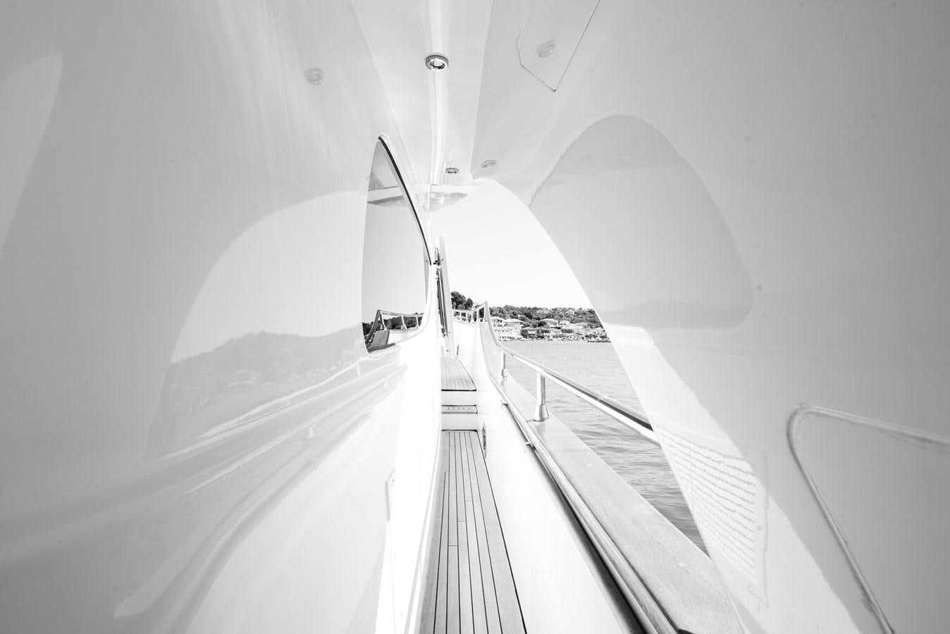 a white hallway with a white ceiling aboard ITACATOO Yacht for Sale