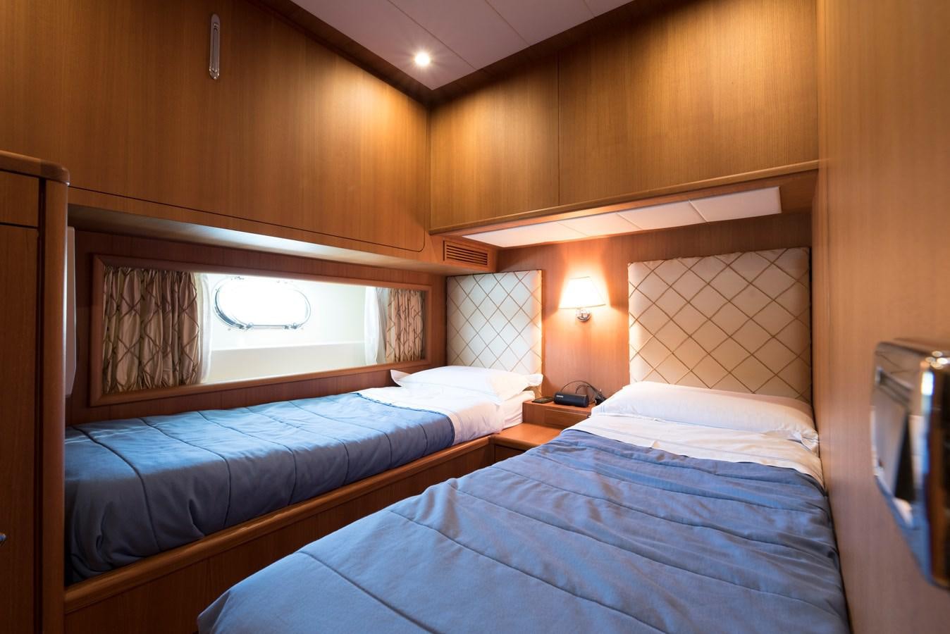 a couple of beds in a room aboard ITACATOO Yacht for Sale