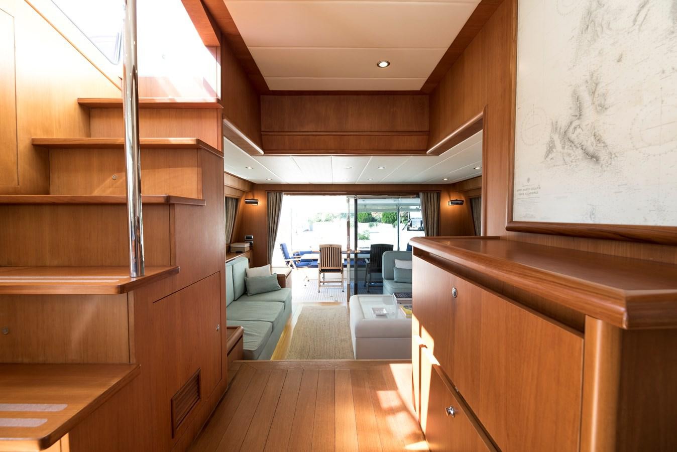 a room with a wood floor and a large window aboard ITACATOO Yacht for Sale