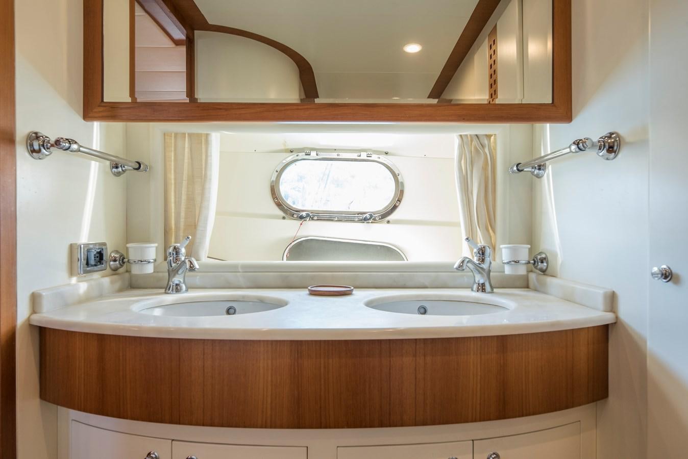 a bathroom with two sinks aboard ITACATOO Yacht for Sale
