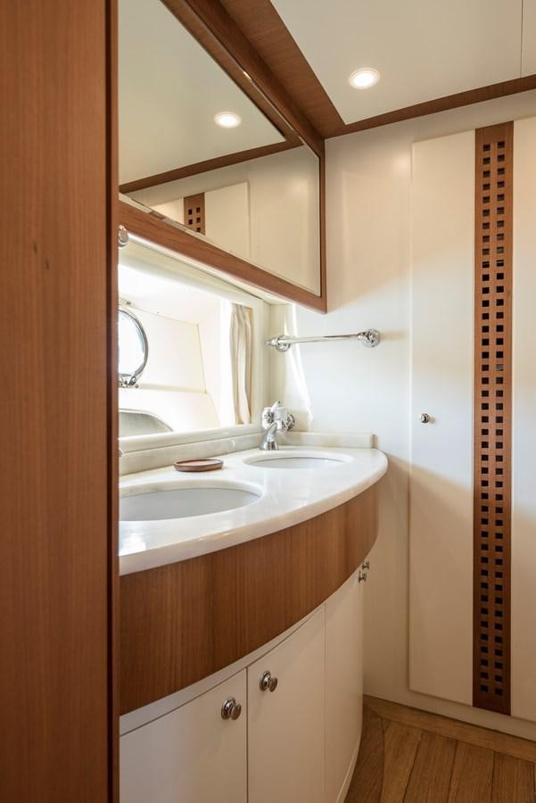 a bathroom with a sink and a mirror aboard ITACATOO Yacht for Sale