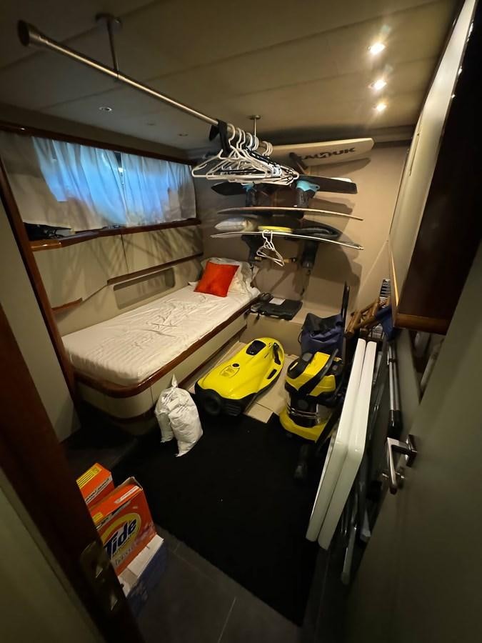 a room with a bed and a chair aboard EL VIP ONE Yacht for Sale