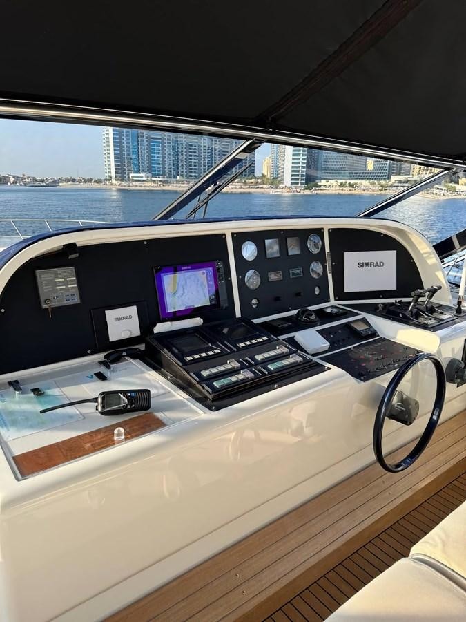 a row of electronic devices on a table aboard EL VIP ONE Yacht for Sale