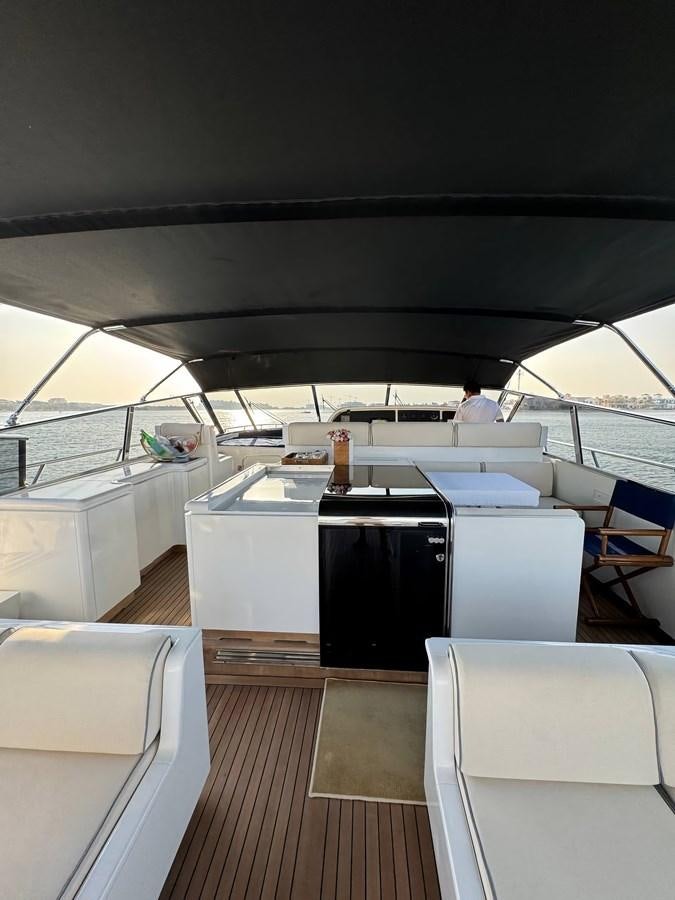 a boat with a table and chairs aboard EL VIP ONE Yacht for Sale
