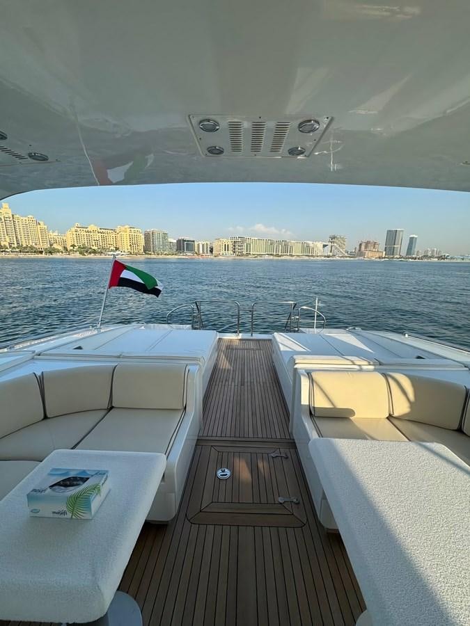 a deck with a view of a city and water aboard EL VIP ONE Yacht for Sale