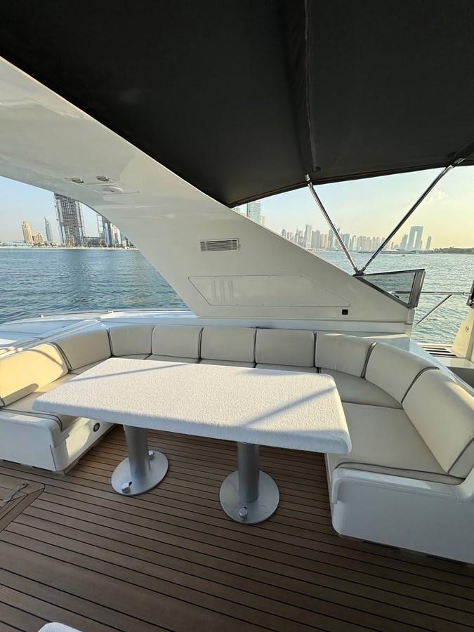 a deck with a view of a city and water aboard EL VIP ONE Yacht for Sale