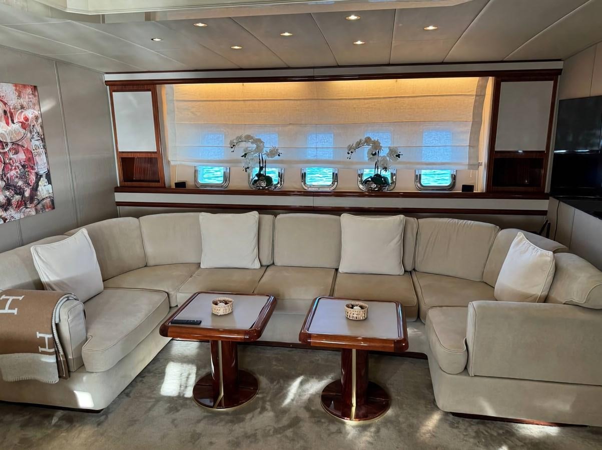 a living room with a couch and a table aboard EL VIP ONE Yacht for Sale