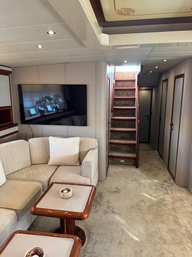 a living room with a large tv aboard EL VIP ONE Yacht for Sale