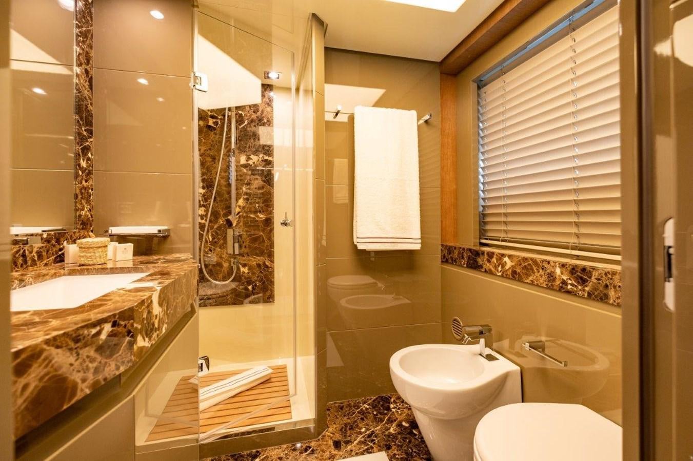 a bathroom with a glass shower aboard BACCARAT Yacht for Sale