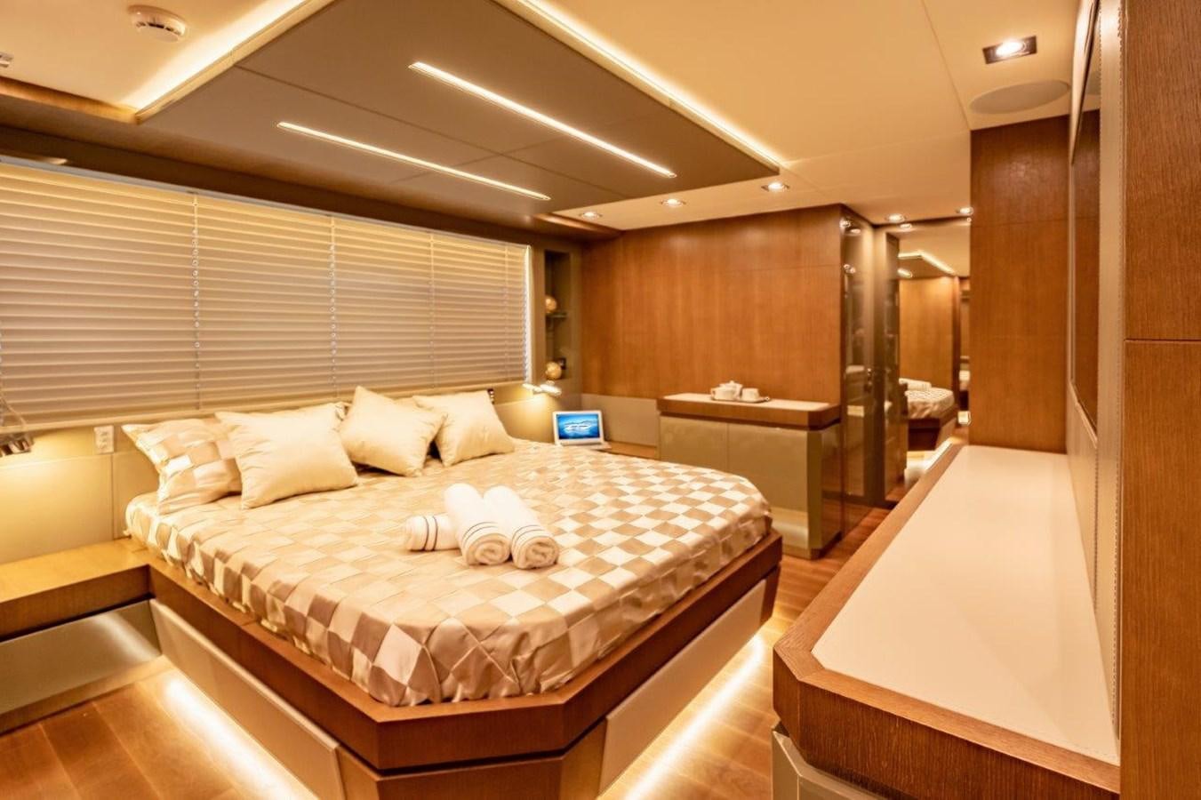 a large bedroom with a large bed aboard BACCARAT Yacht for Sale