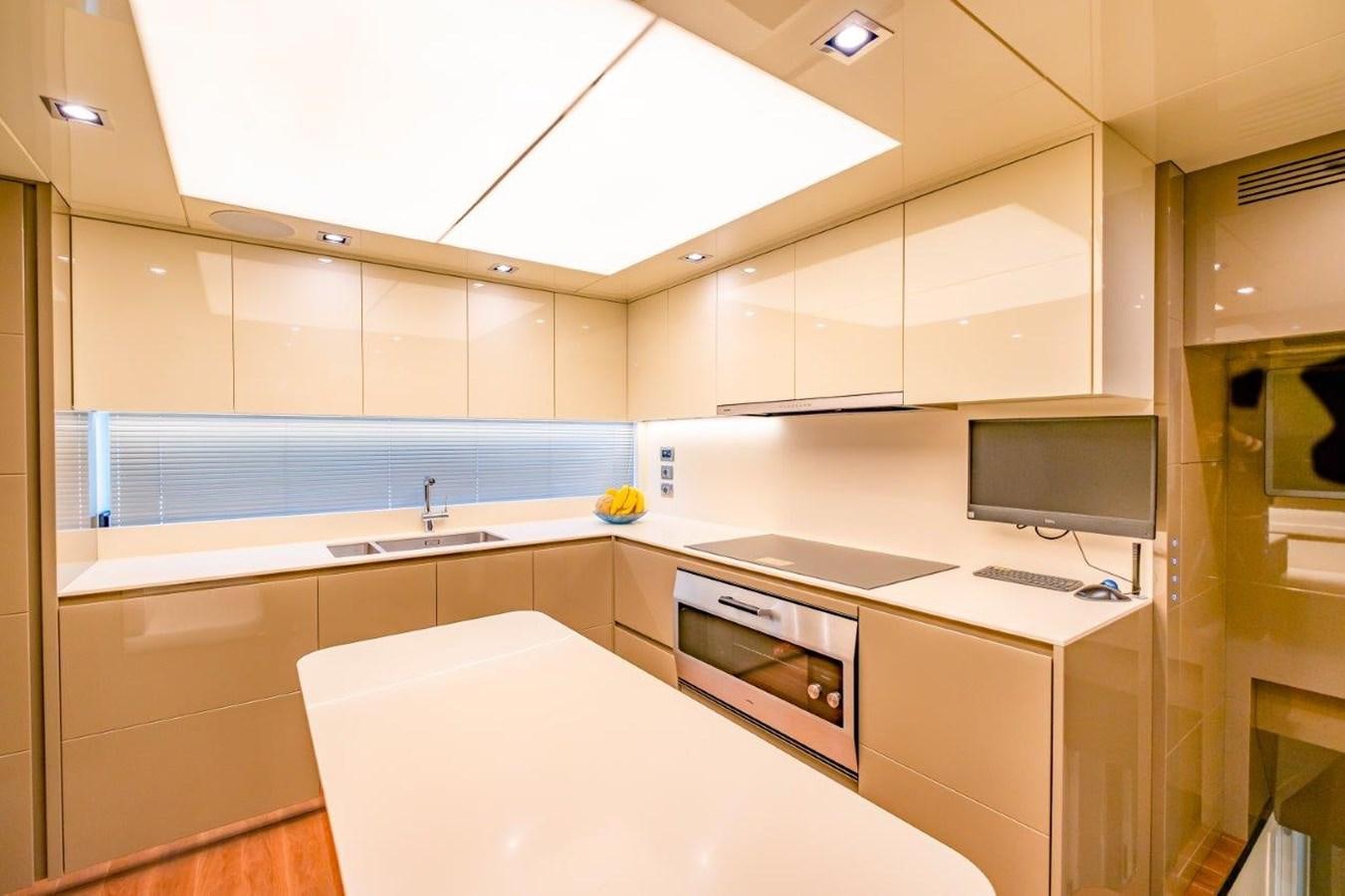 a kitchen with white cabinets aboard BACCARAT Yacht for Sale