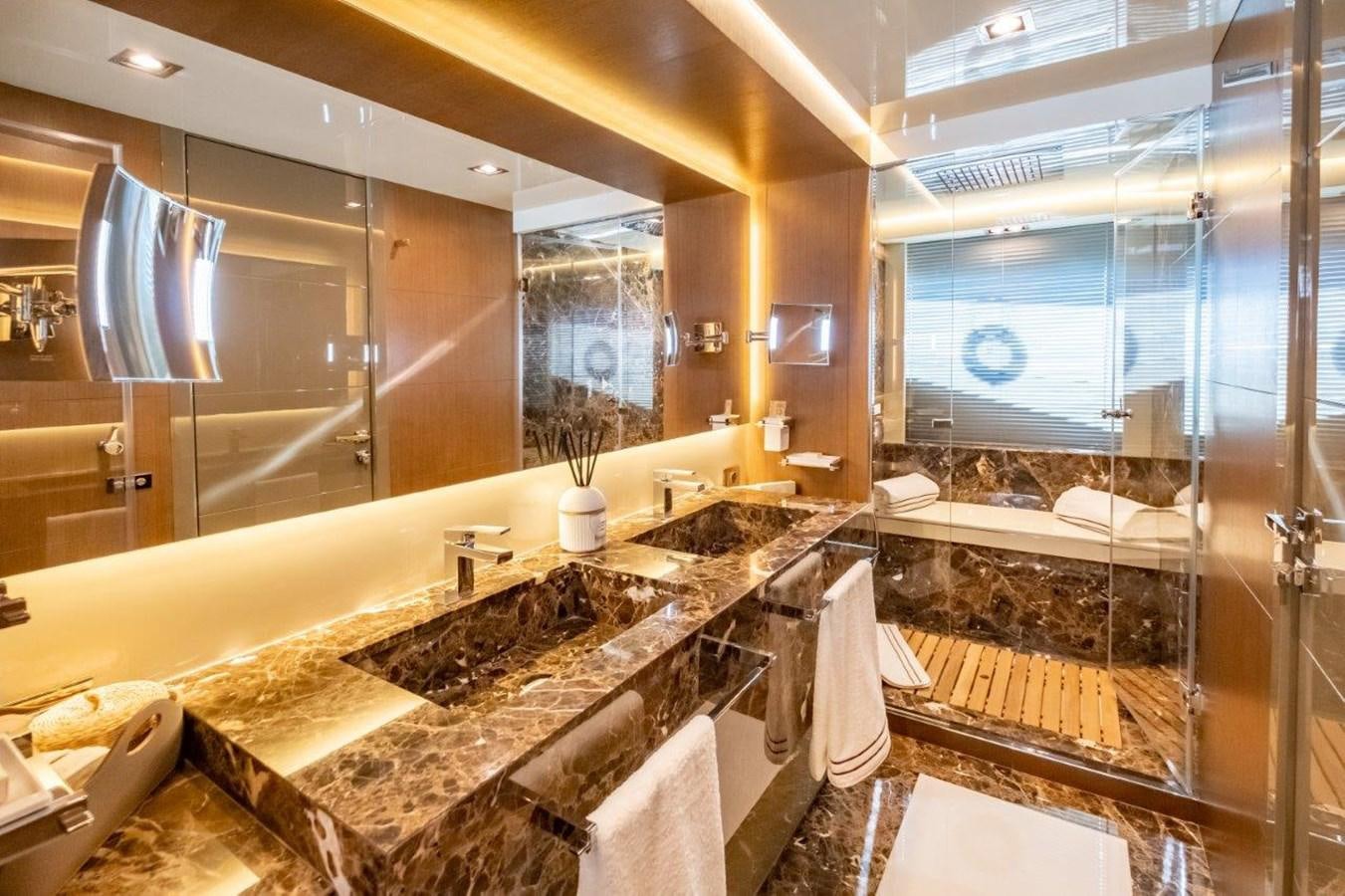 a bathroom with a large mirror aboard BACCARAT Yacht for Sale