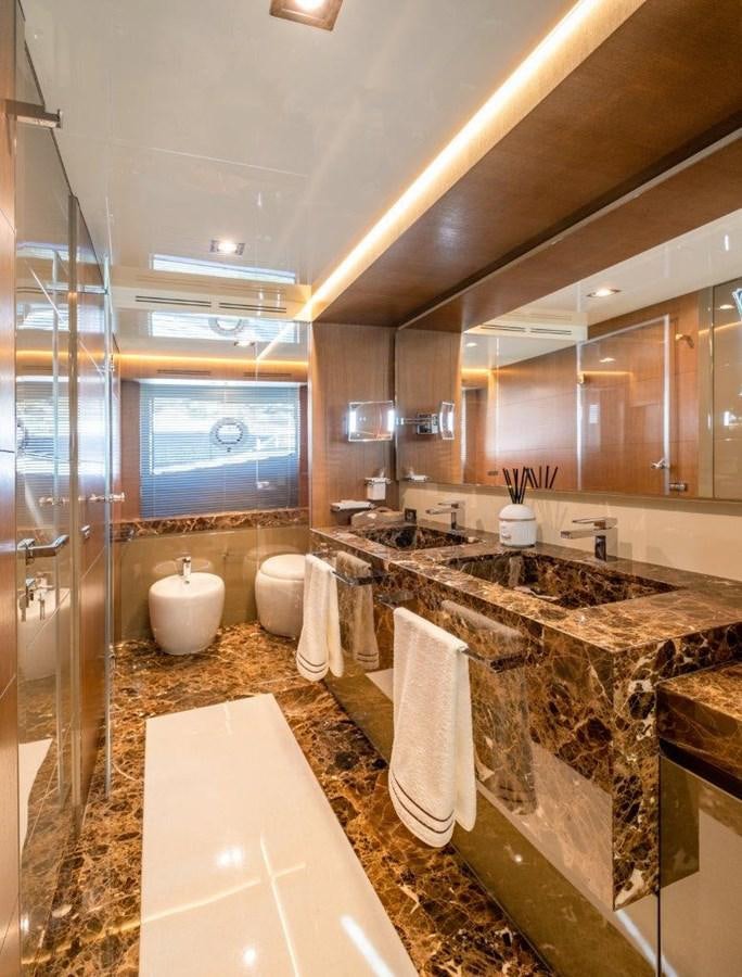 a bathroom with a large mirror aboard BACCARAT Yacht for Sale