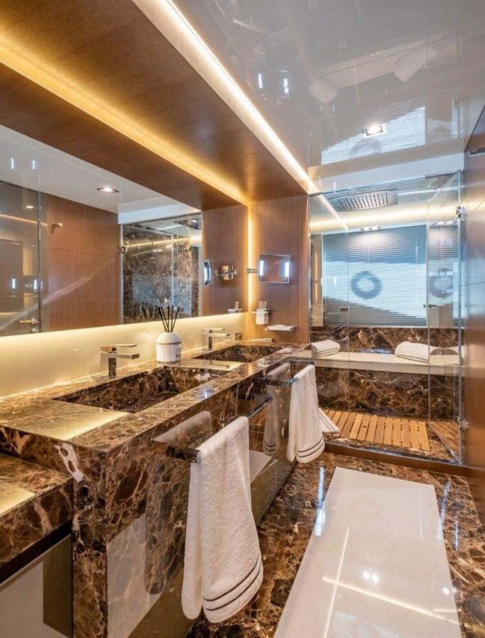 a bathroom with a large mirror aboard BACCARAT Yacht for Sale