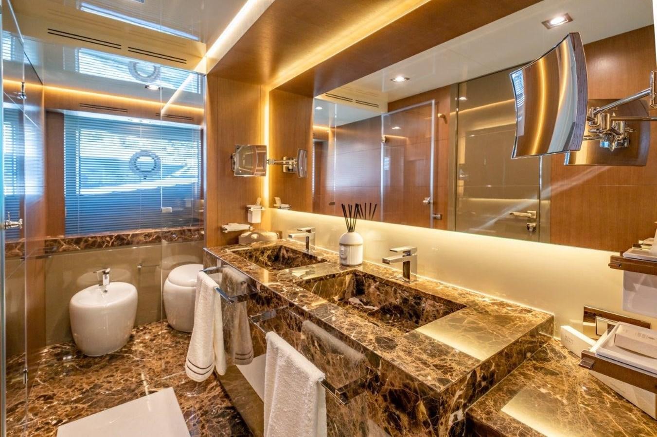 a bathroom with a large mirror aboard BACCARAT Yacht for Sale