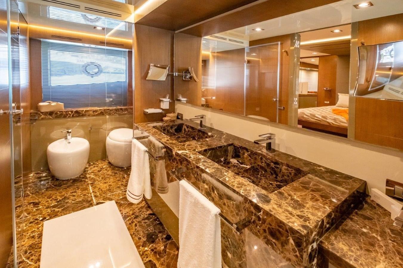 a bathroom with a large marble countertop aboard BACCARAT Yacht for Sale