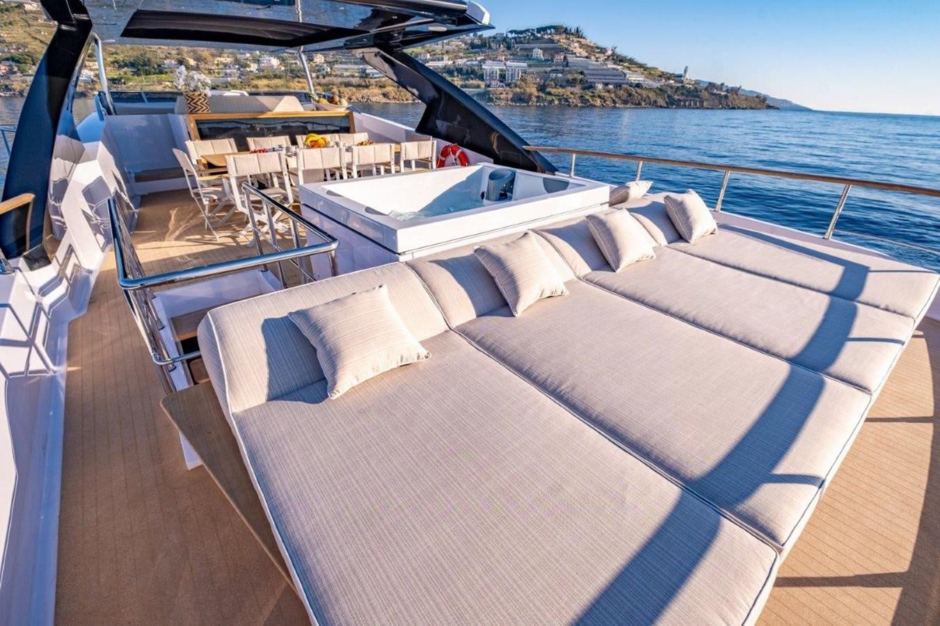 a deck with chairs and a pool aboard BACCARAT Yacht for Sale