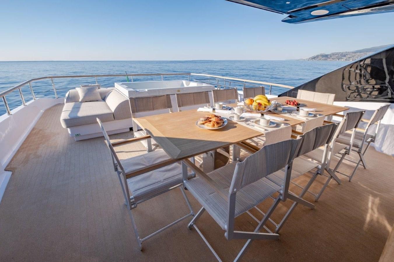 a table with chairs on it aboard BACCARAT Yacht for Sale