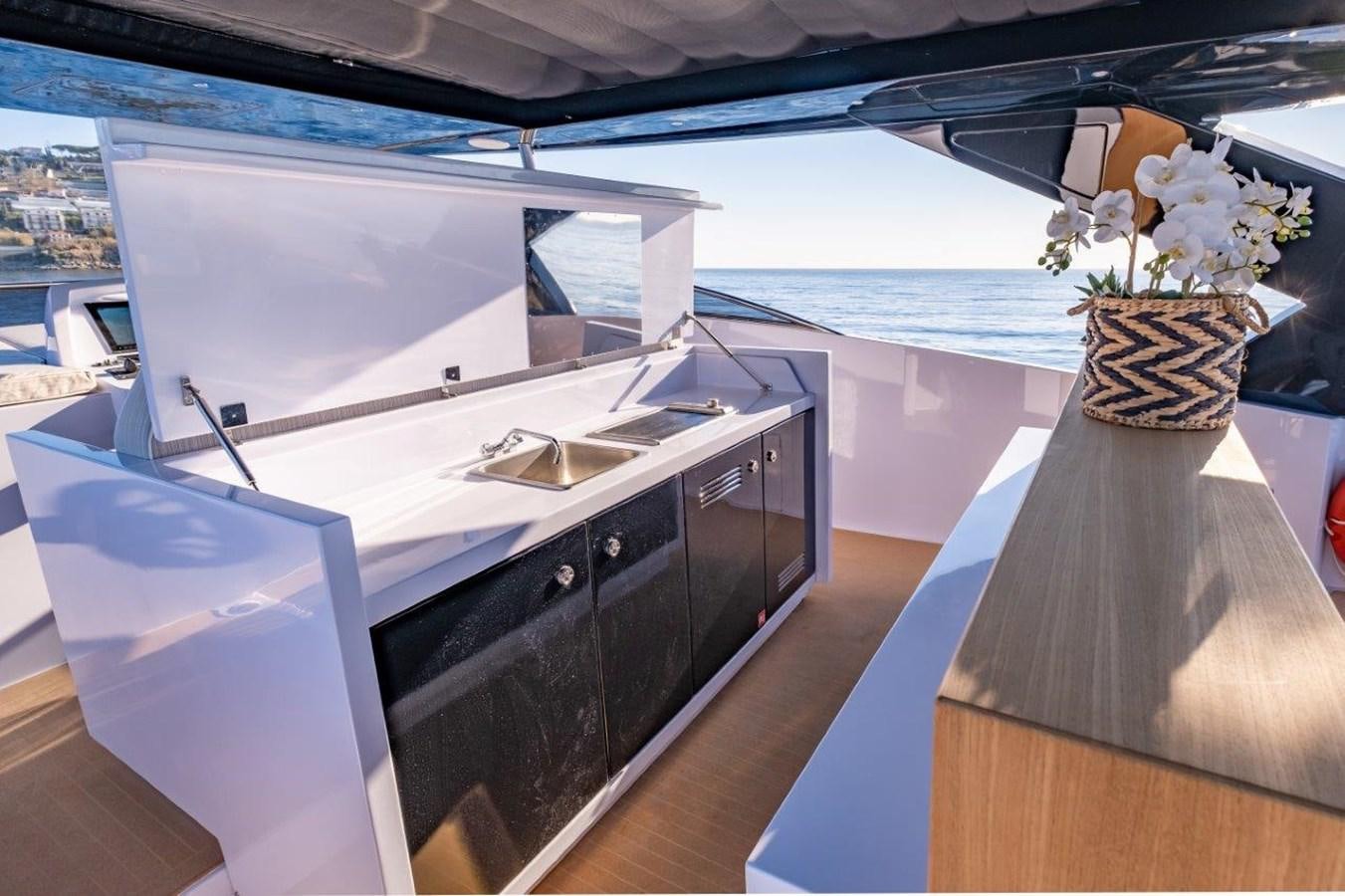 a vase of flowers on a table aboard BACCARAT Yacht for Sale