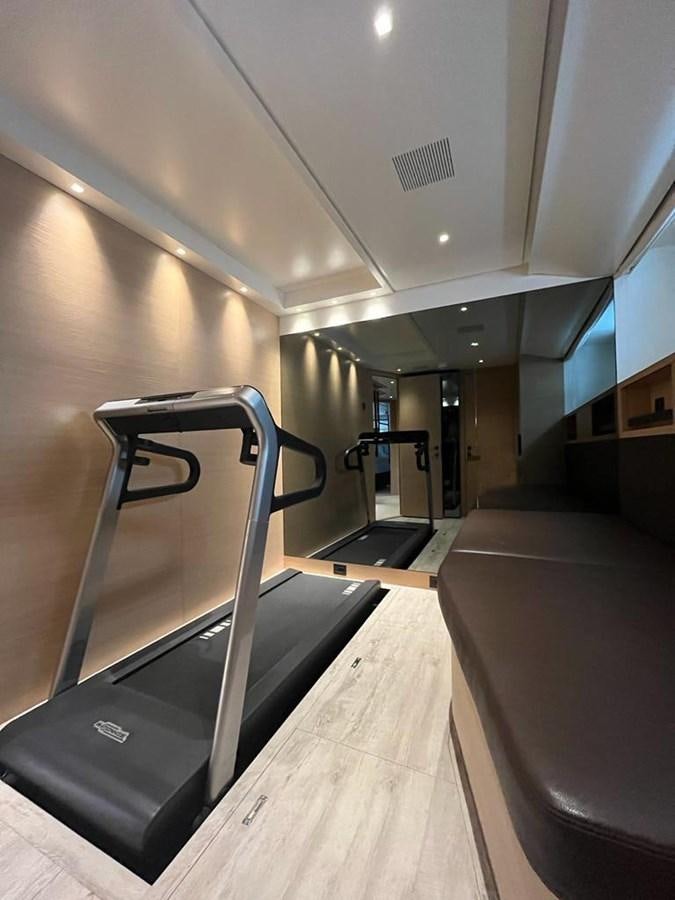 a room with a bench and a chair aboard STRADODO Yacht for Sale