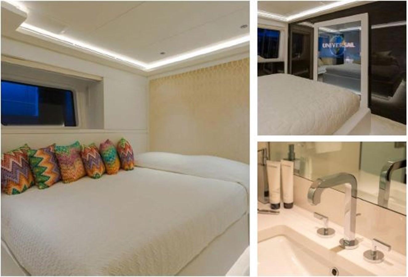 a bedroom with a bed and sink aboard GALA Yacht for Sale