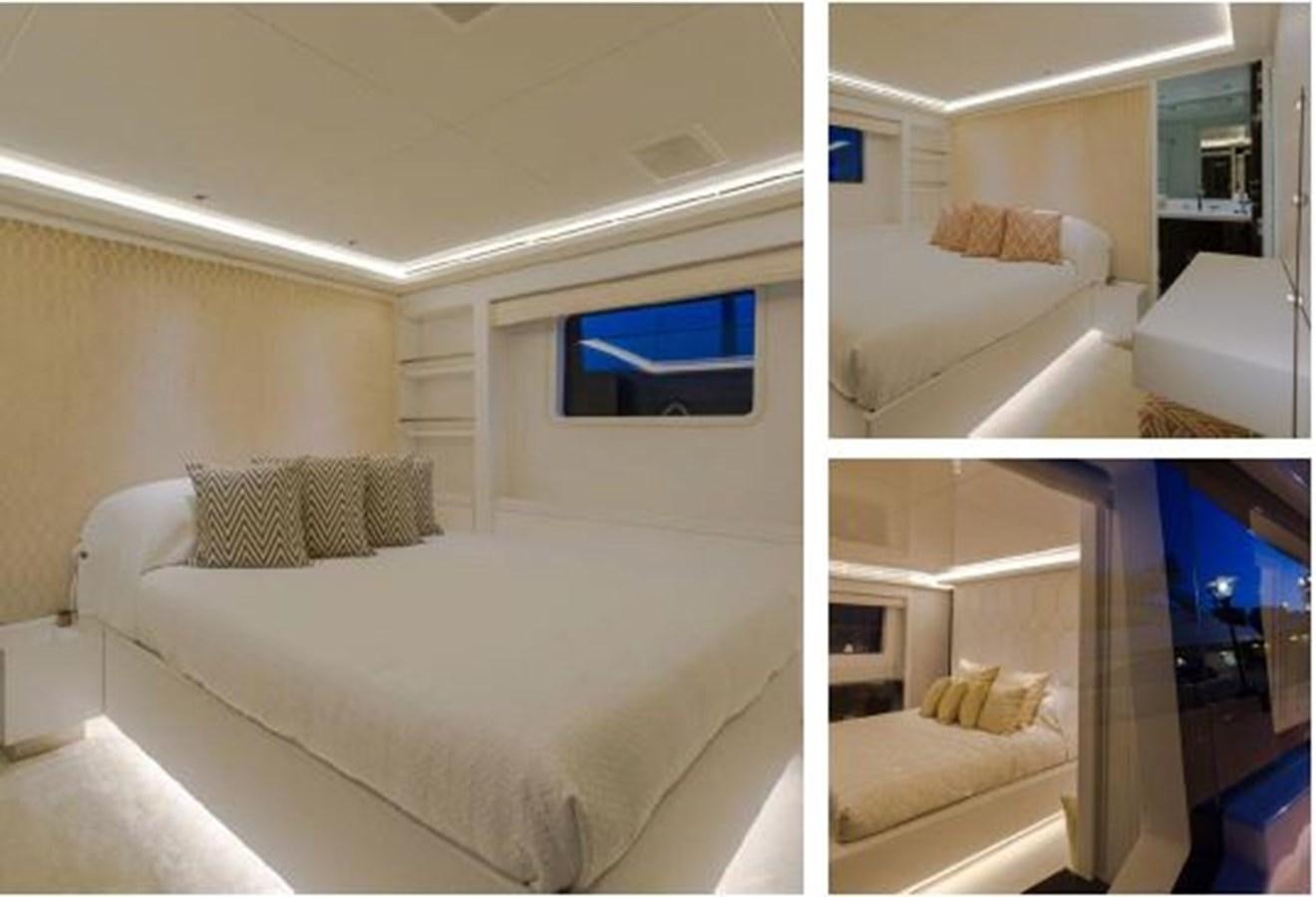 a bedroom with a bed and a television aboard GALA Yacht for Sale