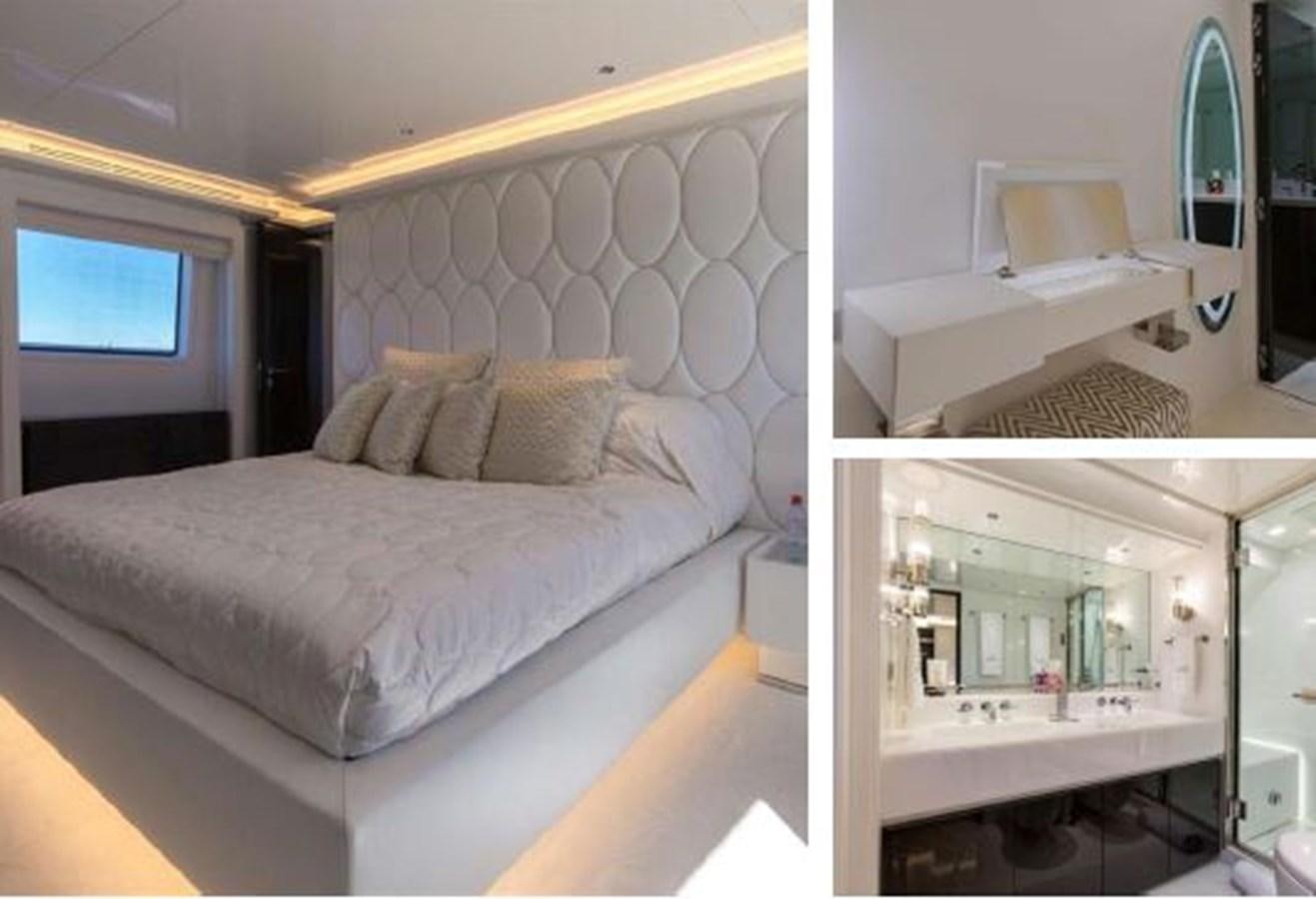 a bedroom with a bed and a desk aboard GALA Yacht for Sale