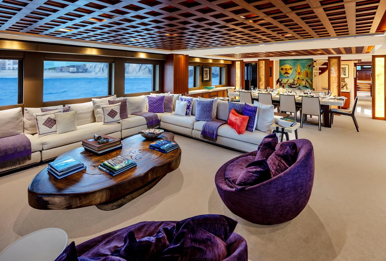 a living room with a couch and a table aboard CHAMPAGNE SEAS Yacht for Sale