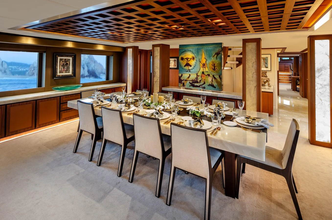 a dining room with a table and chairs aboard CHAMPAGNE SEAS Yacht for Sale
