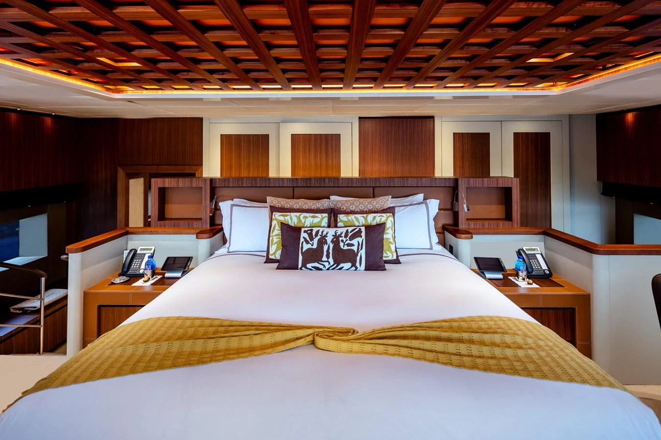a bed with a white sheet and pillows aboard CHAMPAGNE SEAS Yacht for Sale