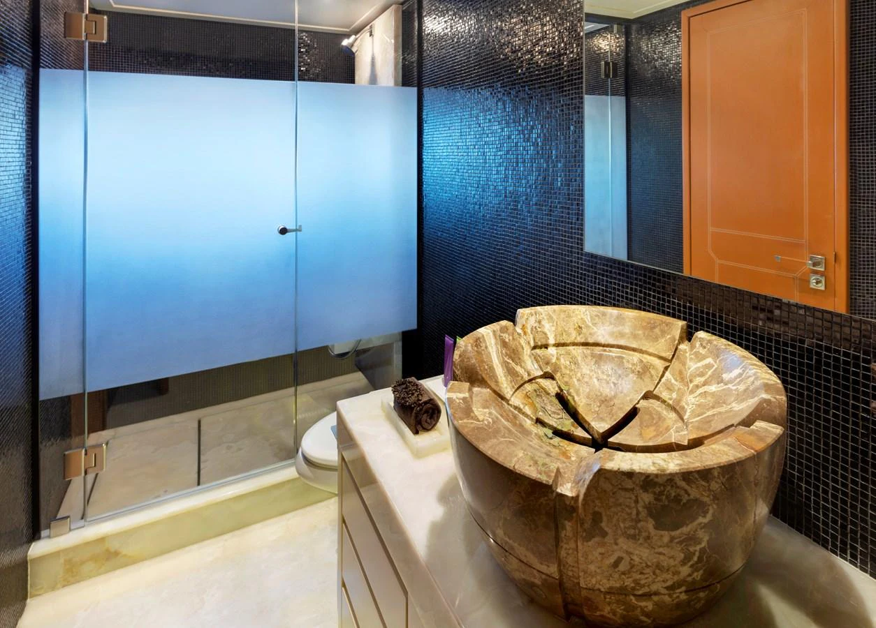 a large basket on a toilet aboard CHAMPAGNE SEAS Yacht for Sale