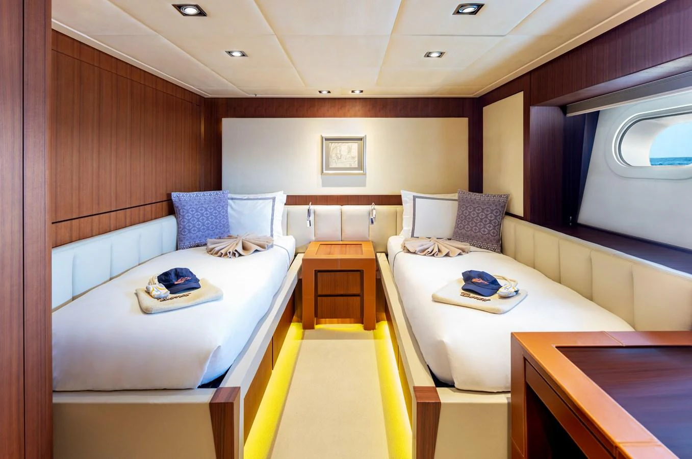 a room with a bed and a desk aboard CHAMPAGNE SEAS Yacht for Sale