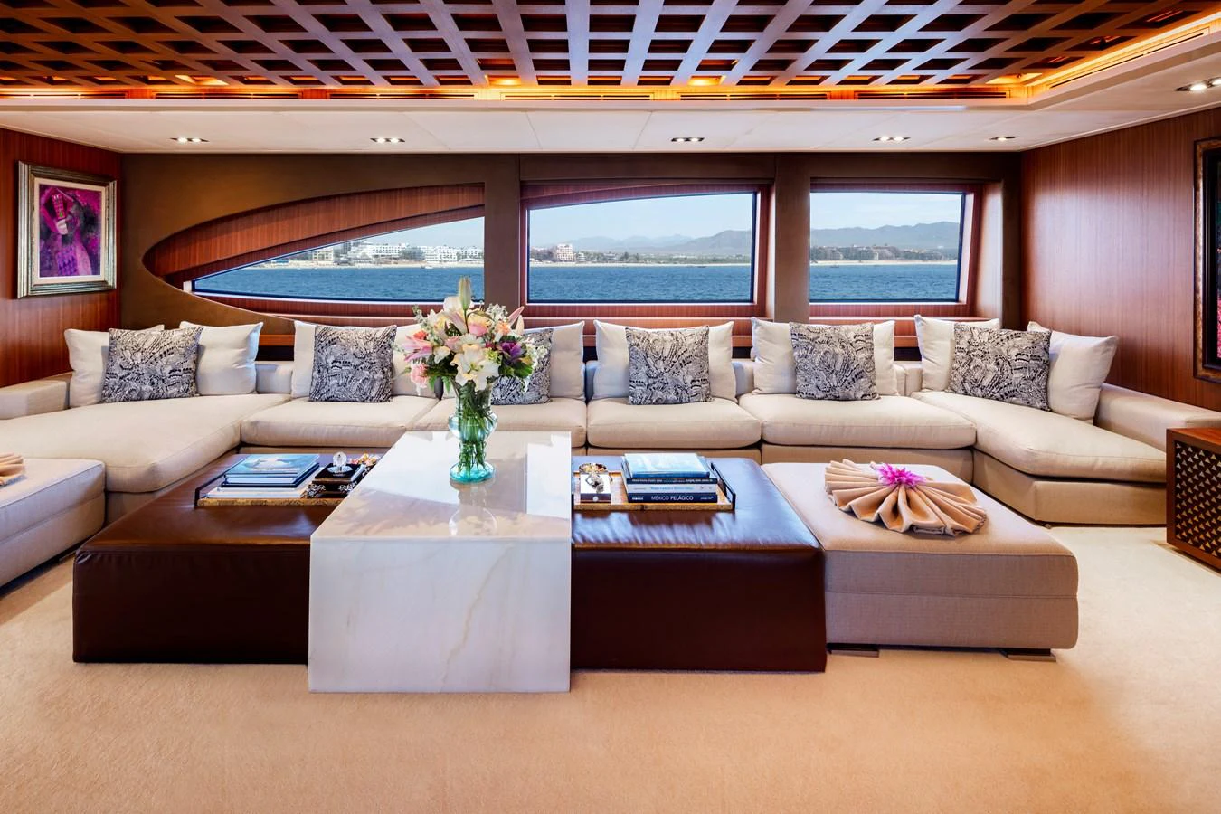 a living room with a large sofa aboard CHAMPAGNE SEAS Yacht for Sale